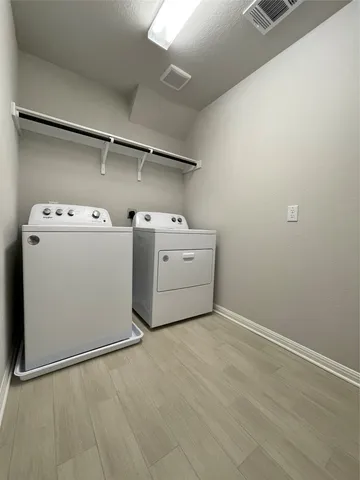 a bathroom with a double vanity sink and mirror