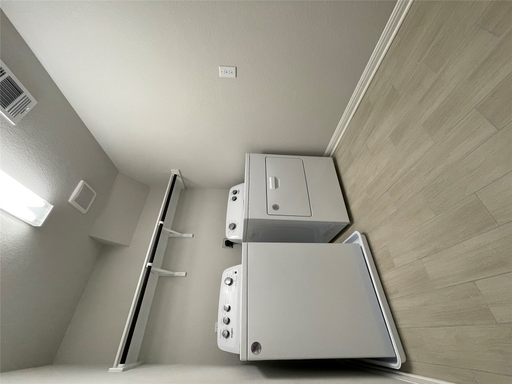 125 Old Stagecoach Road Jarrell, TX 76537 - Photo 27 of 31 a utility room with dryer and washer