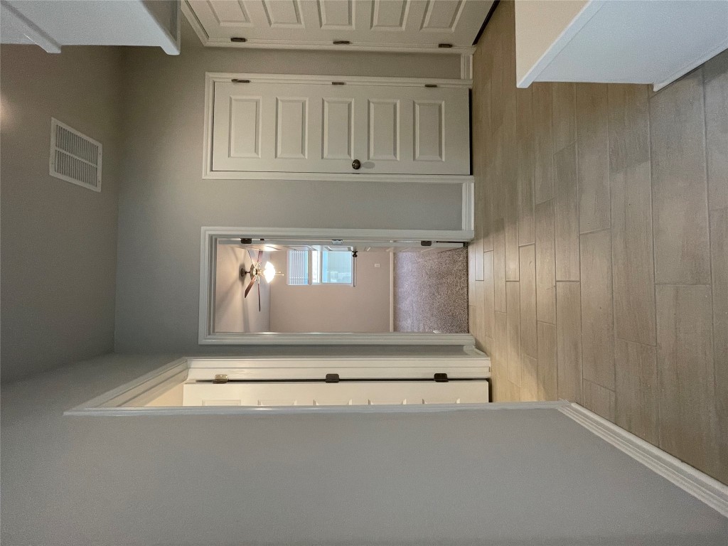 125 Old Stagecoach Road Jarrell, TX 76537 - Photo 7 of 31 an empty room with closet and mirror