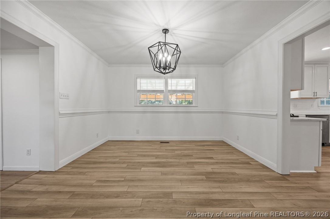 309 Cornith Road Pembroke, NC 28372 - Photo 15 of 49 a view of an empty room with wooden floor and windows