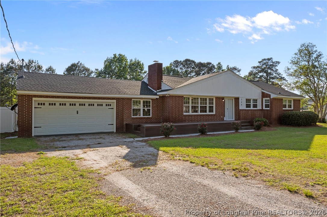 309 Cornith Road Pembroke, NC 28372 - Photo 2 of 49 a view of a house with a swimming pool