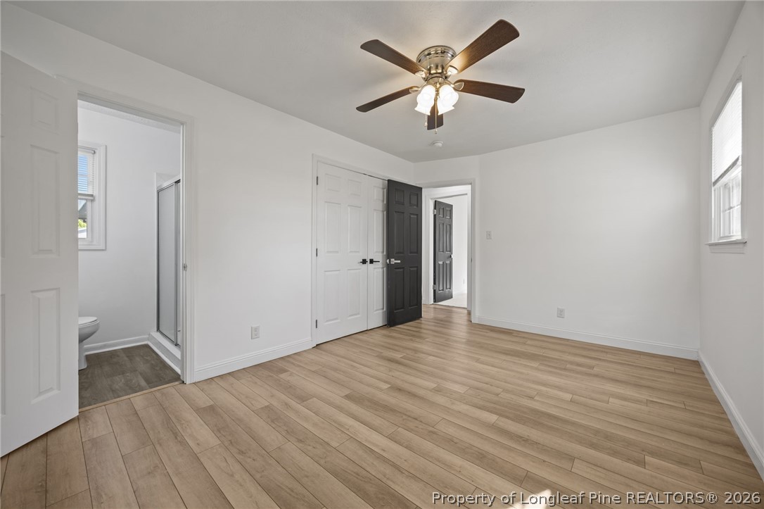 309 Cornith Road Pembroke, NC 28372 - Photo 23 of 49 an empty room with wooden floor and windows
