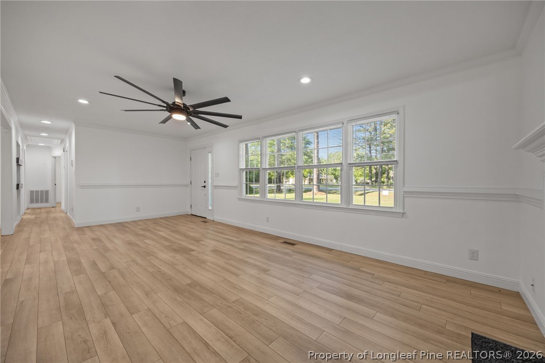309 Cornith Road Pembroke, NC 28372 - Photo 27 of 49 an empty room with wooden floor fan and windows