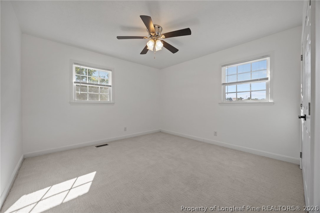 309 Cornith Road Pembroke, NC 28372 - Photo 33 of 49 an empty room with a window and a ceiling fan