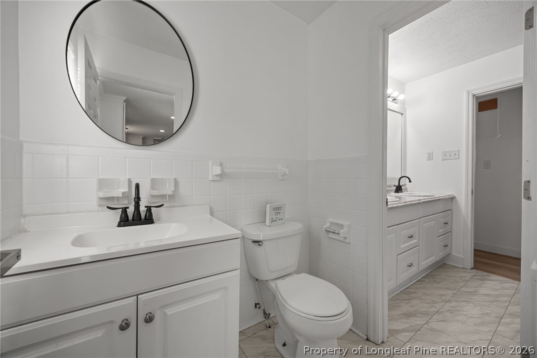 309 Cornith Road Pembroke, NC 28372 - Photo 38 of 49 a bathroom with a toilet a sink and a mirror
