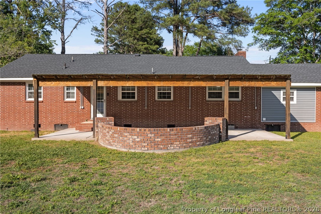 309 Cornith Road Pembroke, NC 28372 - Photo 45 of 49 a backyard of a house with table and chairs