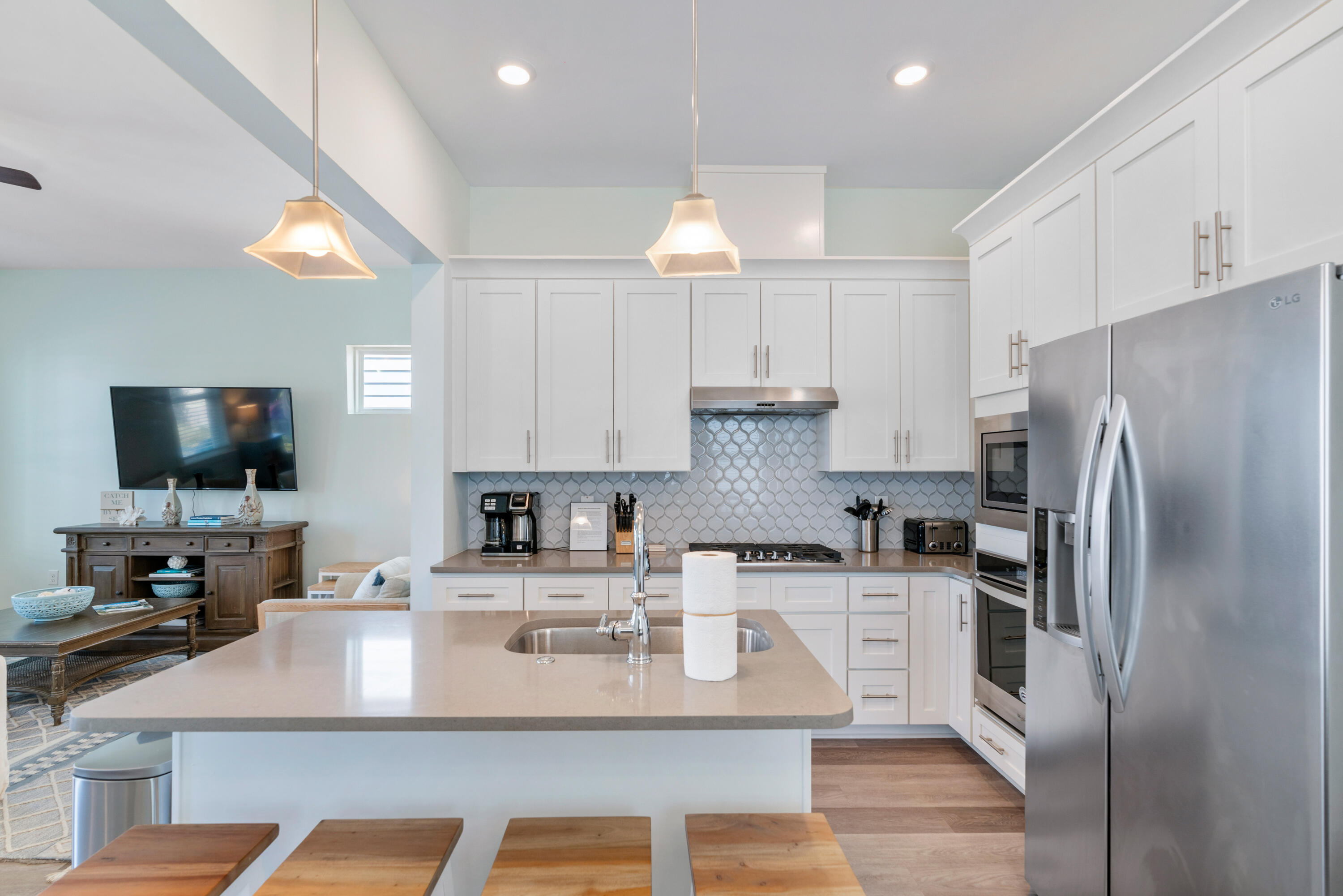 30 Constant Avenue Santa Rosa Beach, FL 32459 - Photo 11 of 51 a kitchen with kitchen island granite countertop a sink a counter top space stainless steel appliances and cabinets