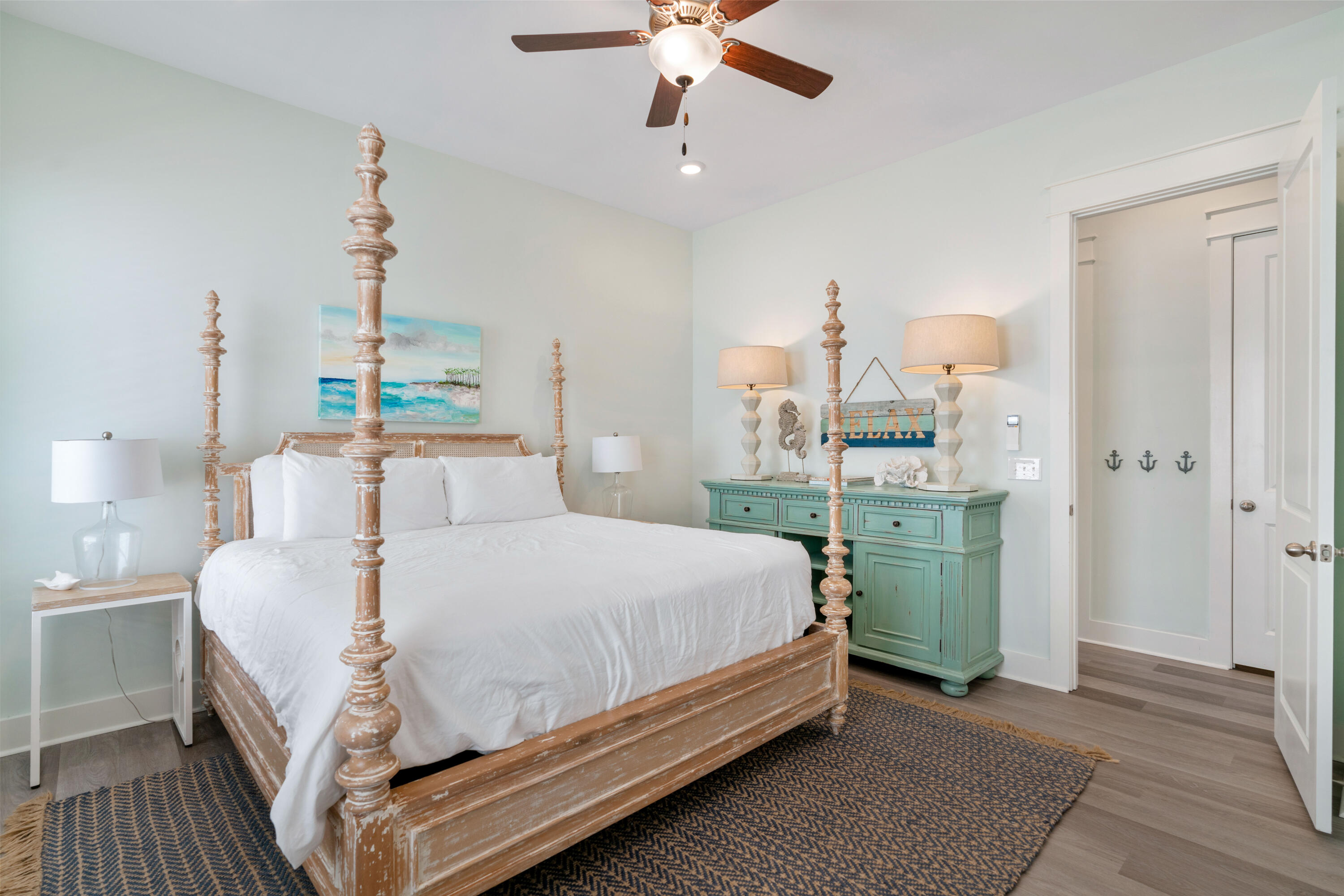 30 Constant Avenue Santa Rosa Beach, FL 32459 - Photo 15 of 51 a bedroom with a bed and a chandelier