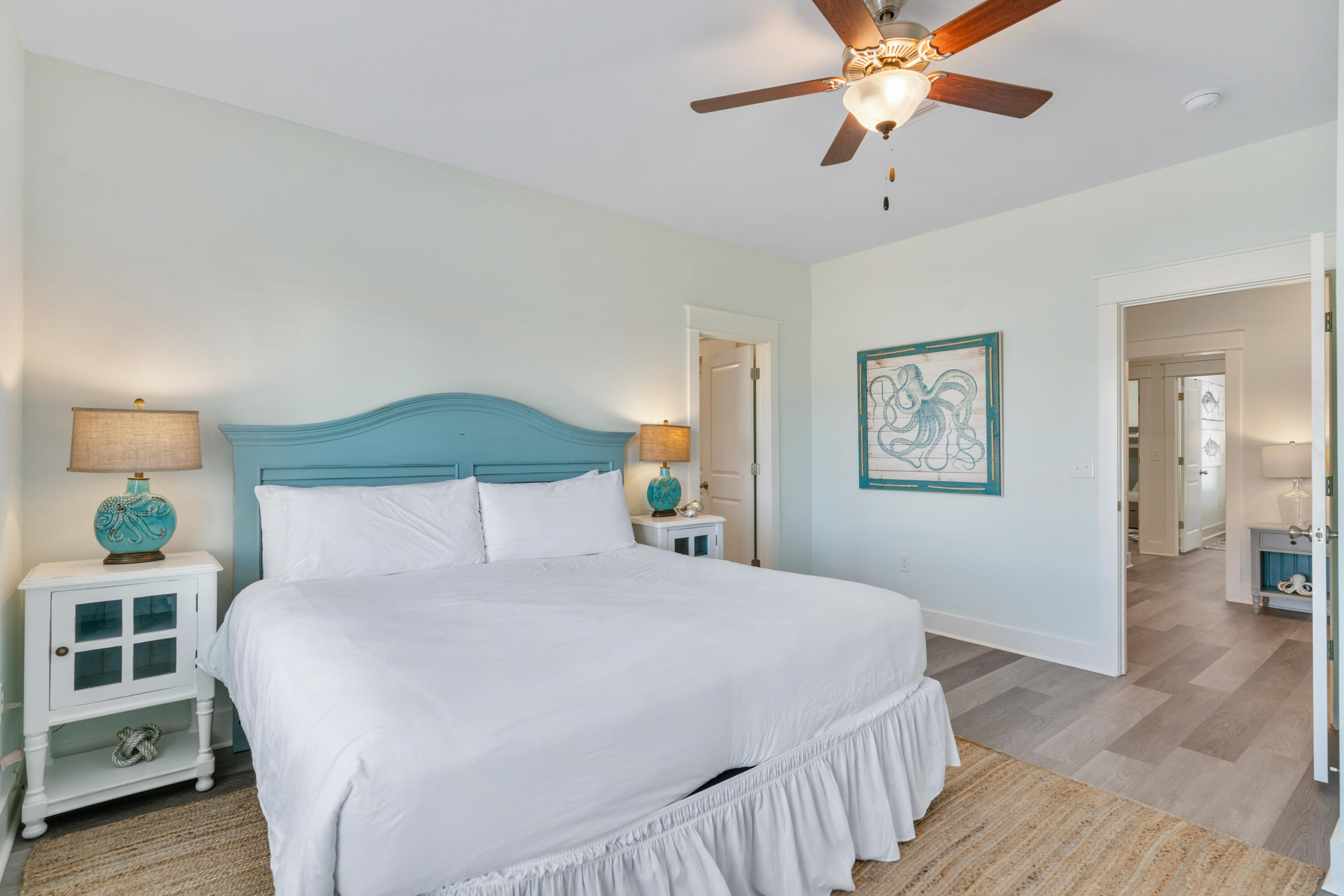 30 Constant Avenue Santa Rosa Beach, FL 32459 - Photo 21 of 51 a bedroom with a large bed and a chandelier
