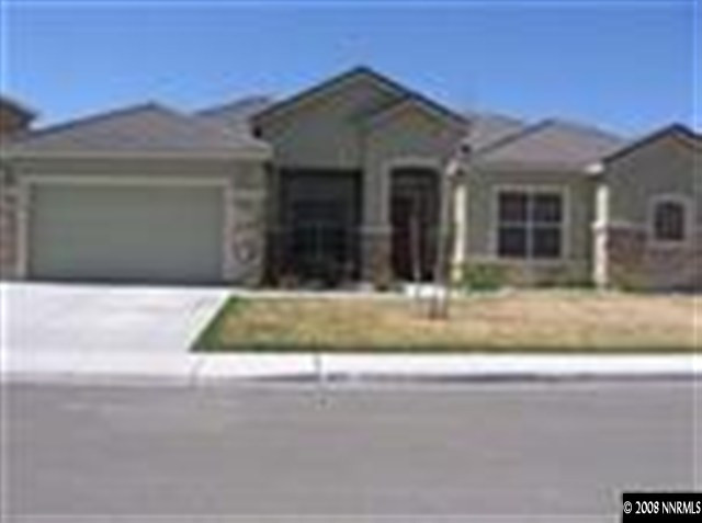 1677 Gemtown Drive Reno, NV 89521 - Photo 1 of 7 a view of a white house with a small yard and potted plants