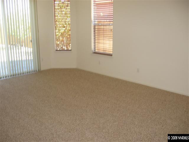 1677 Gemtown Drive Reno, NV 89521 - Photo 5 of 7 an empty room with a window