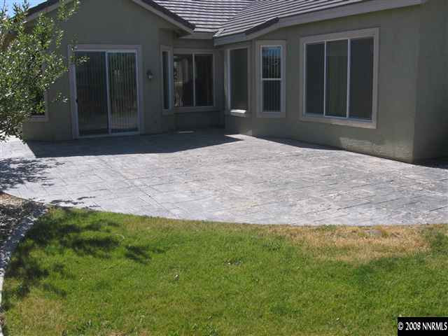 1677 Gemtown Drive Reno, NV 89521 - Photo 7 of 7 a front view of a house with a yard and garage