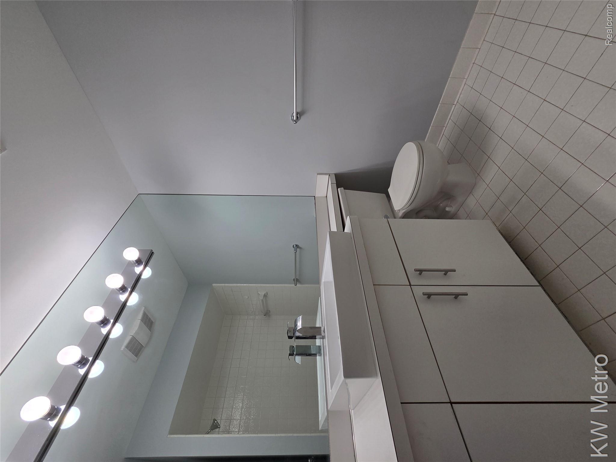6680 Ridgefield Circle, Unit 104 West Bloomfield, MI 48322 - Photo 15 of 20 Full bathroom featuring vanity and light tile patterned floors