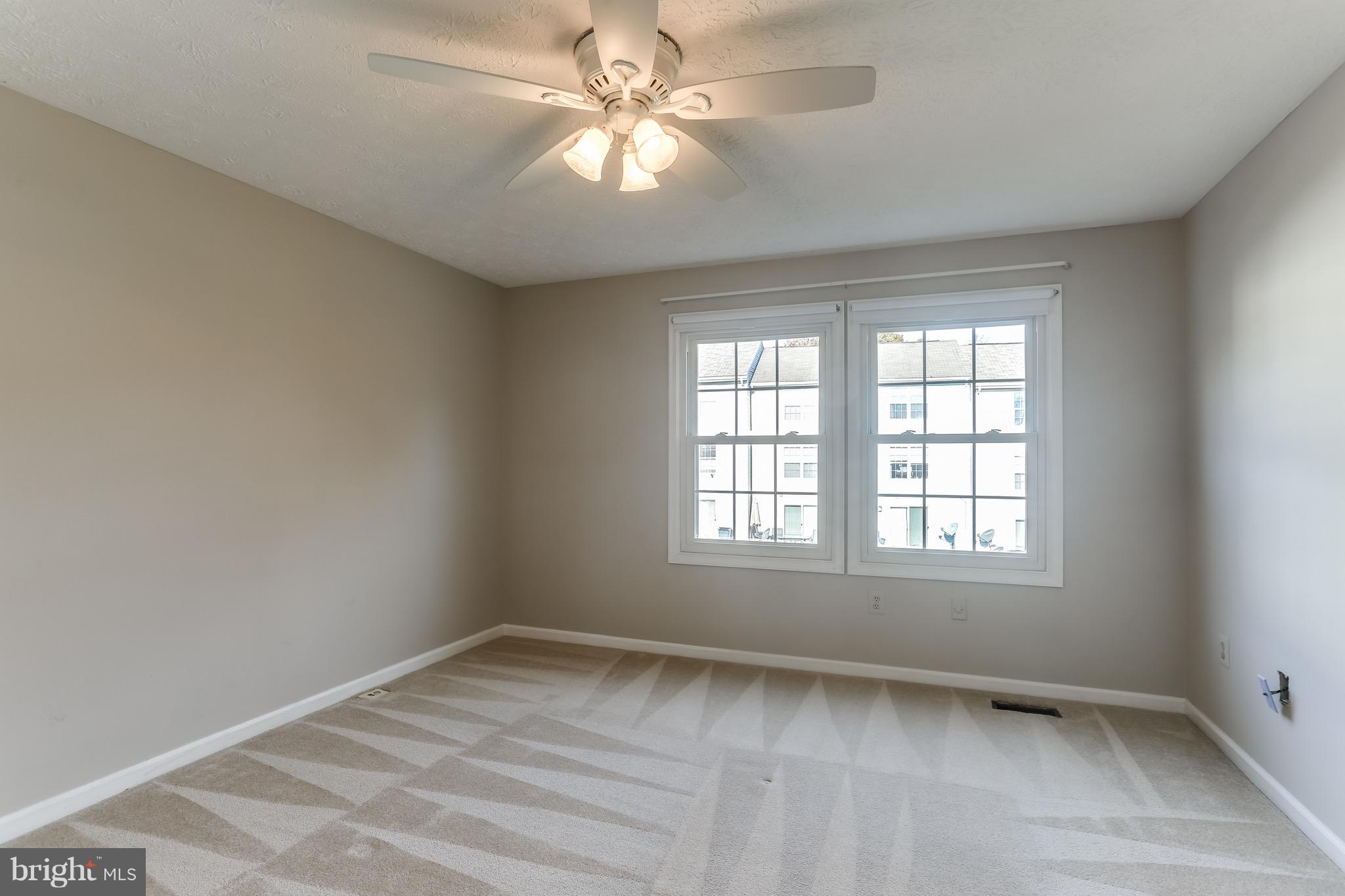 6 Ramsgate Court Halethorpe, MD 21227 - Photo 18 of 29 an empty room with a window and a fan