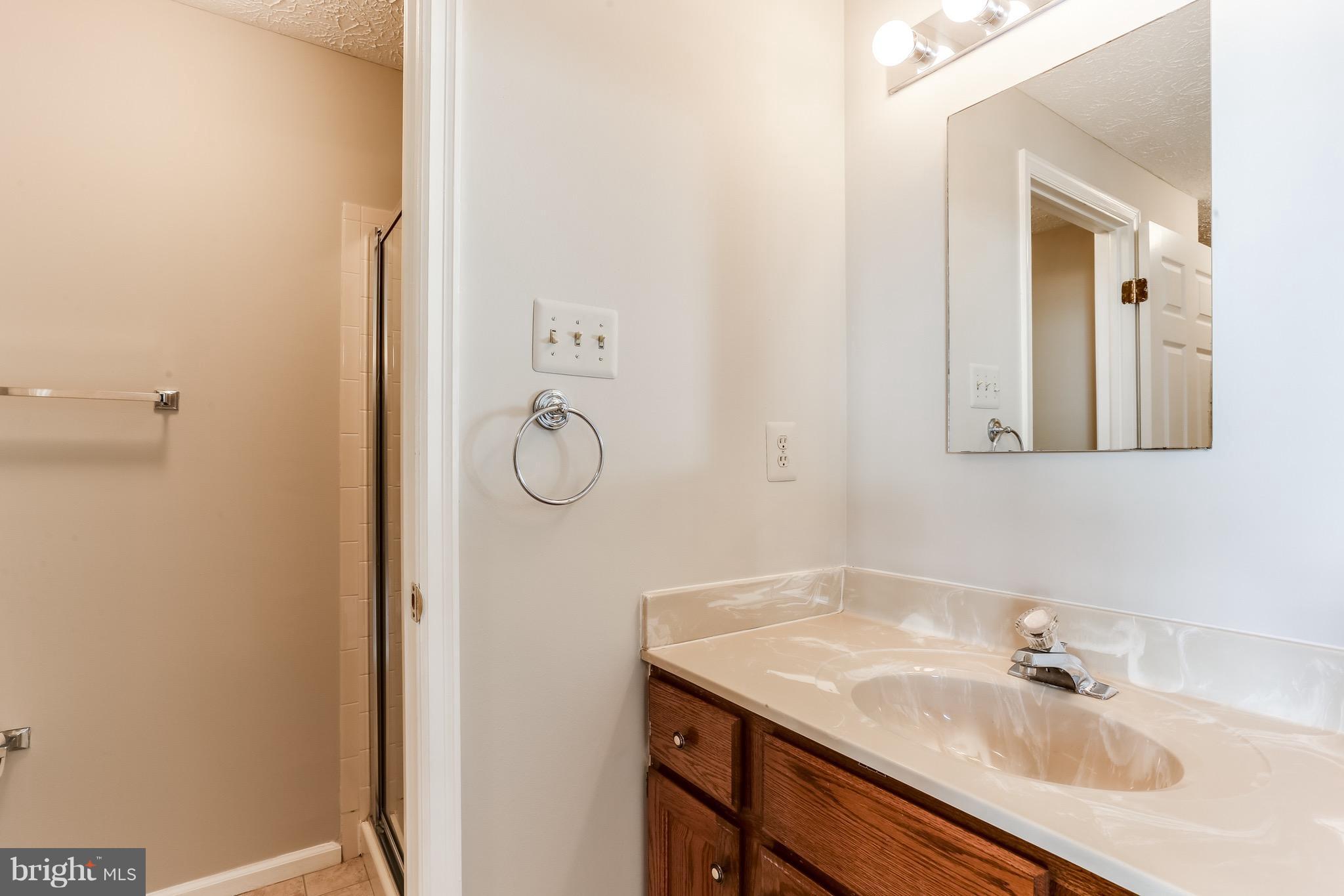 6 Ramsgate Court Halethorpe, MD 21227 - Photo 21 of 29 a bathroom with a sink and a mirror