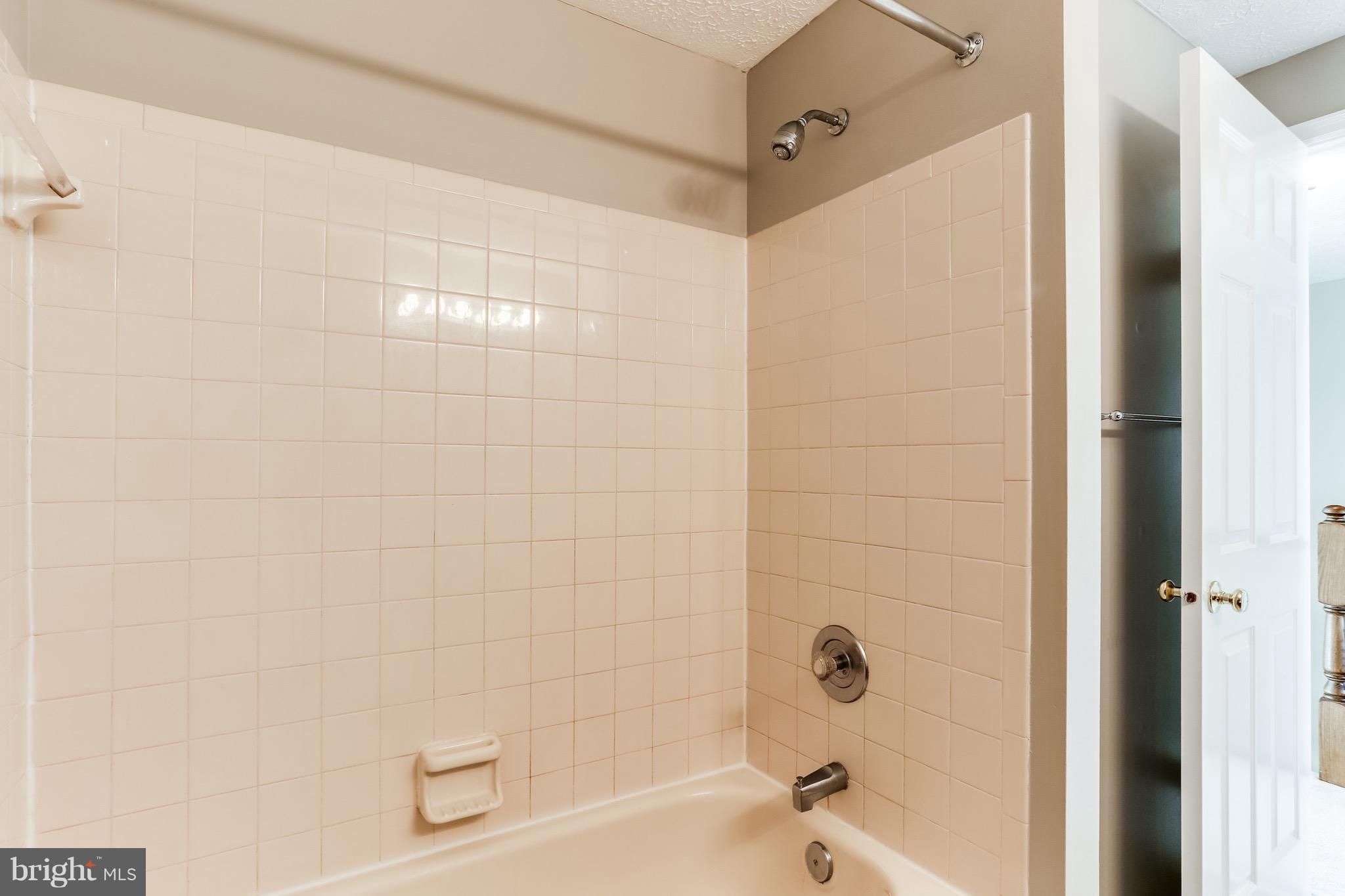 6 Ramsgate Court Halethorpe, MD 21227 - Photo 26 of 29 a bathroom with a bathtub and a shower