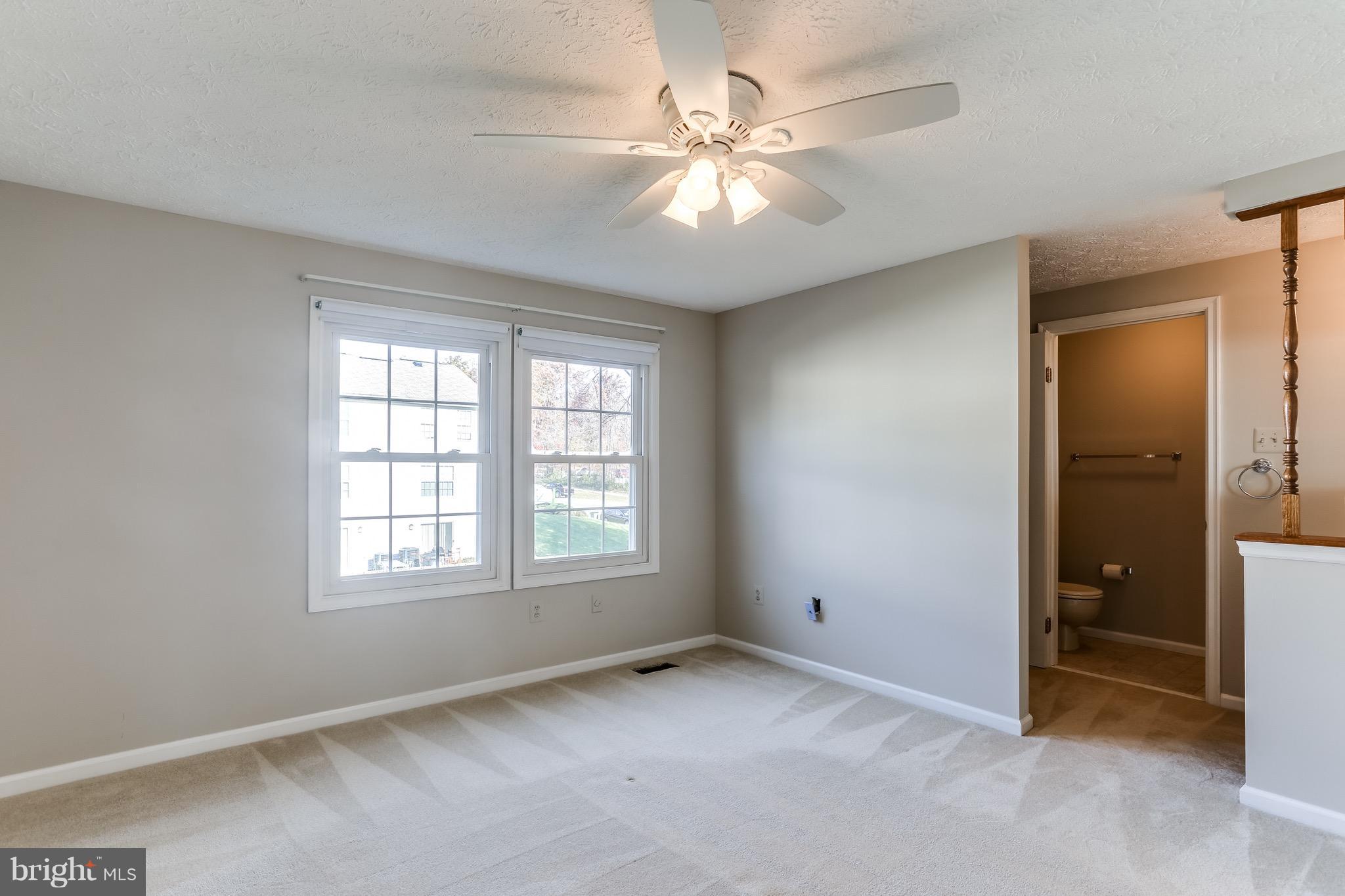 6 Ramsgate Court Halethorpe, MD 21227 - Photo 4 of 29 an empty room with windows and fan