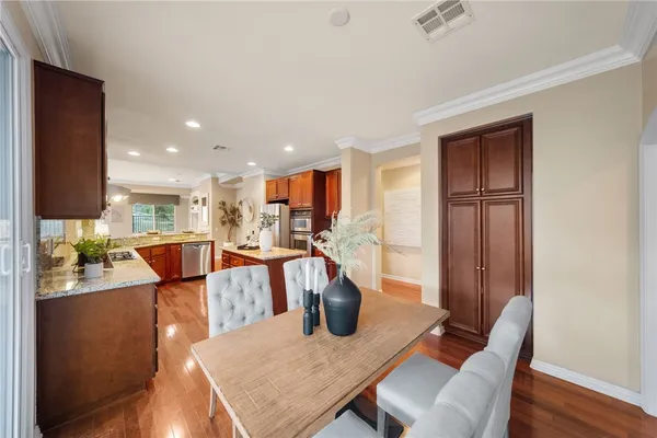 a view of a dining room with furniture window and wooden floor