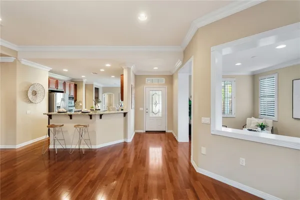 a view of a dining room with furniture and wooden floor