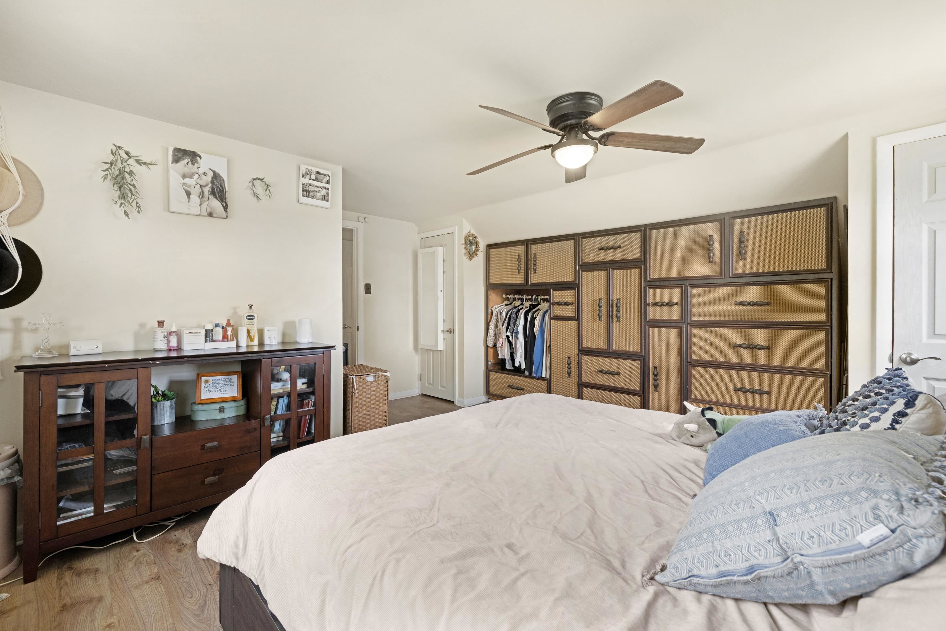 545 Breakwater Road Erma, NJ 08204 - Photo 16 of 27 a bedroom with a large bed and a chandelier