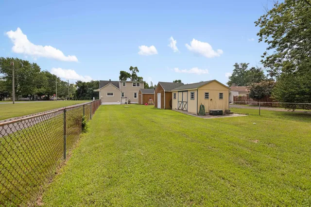 a view of a lake with a house in the background