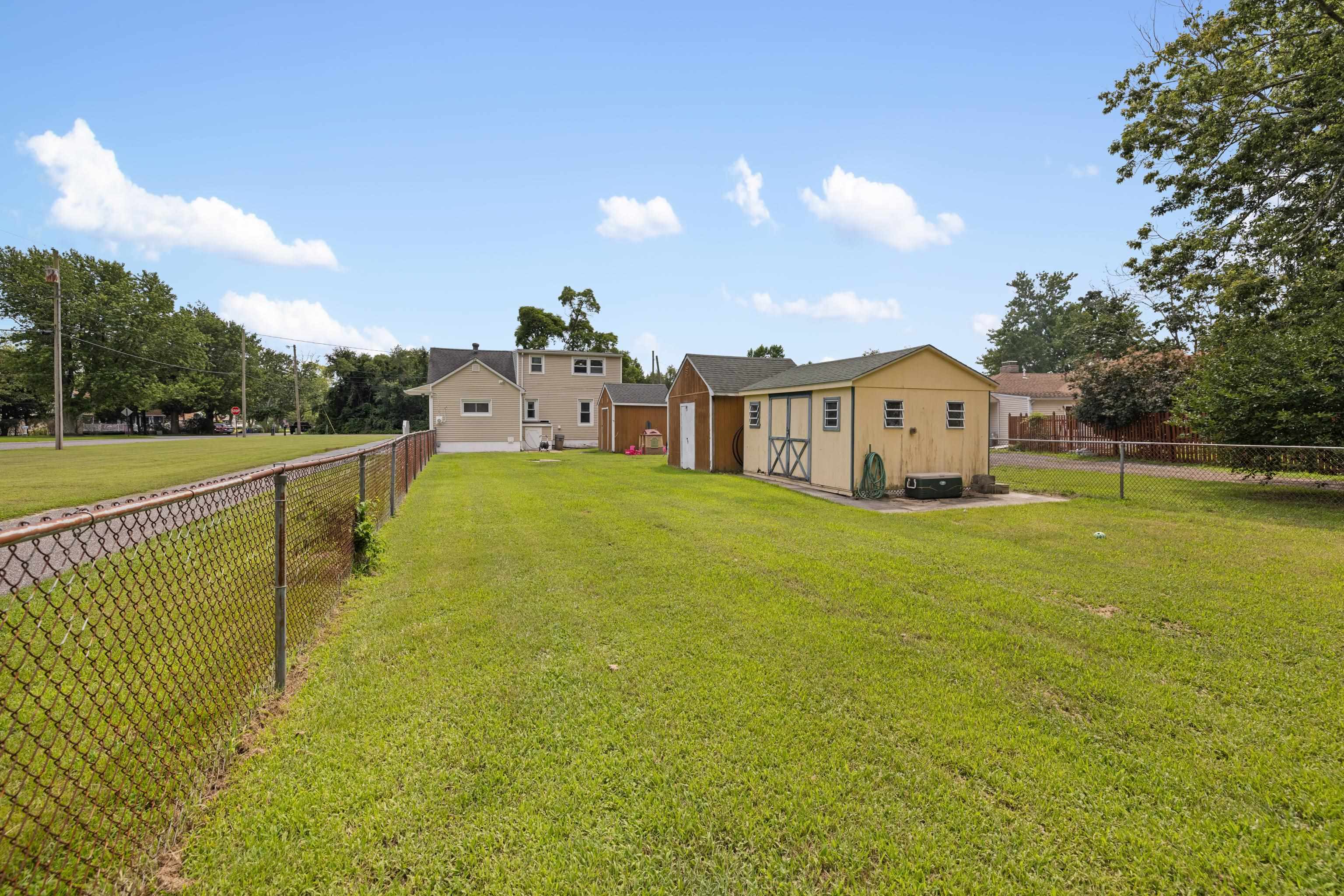 545 Breakwater Road Erma, NJ 08204 - Photo 23 of 27 a view of a lake with a house in the background