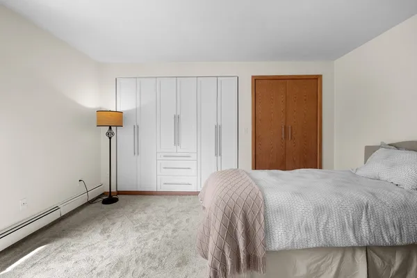 a bedroom with a bed and a table