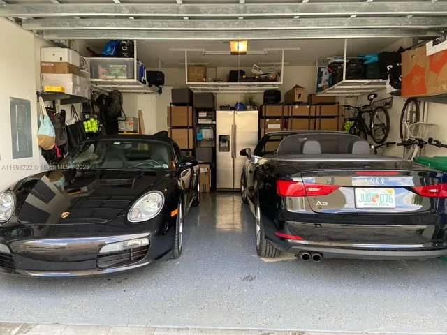 a kitchen with a sink a microwave a stove and refrigerator