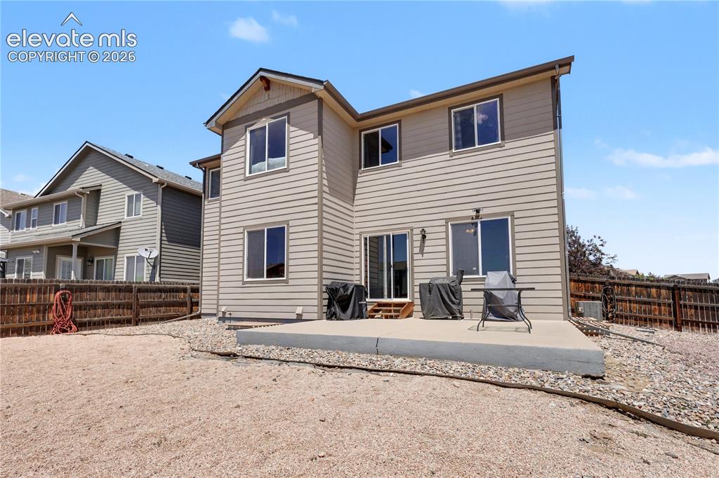 6598 Alliance Loop Colorado Springs, CO 80925 - Photo 38 of 39 Multi-level siding exterior featuring a ground-level concrete patio