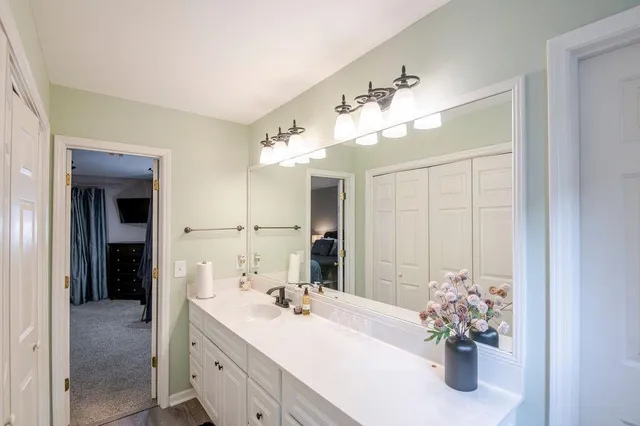 a bathroom with a window and a shower