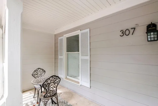 a table and chair sitting in a bathroom