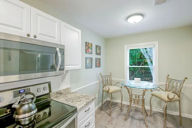 a workspace with furniture and window