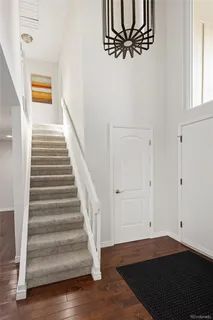 a view of an entryway with wooden floor