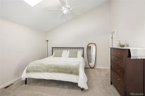 a bedroom with a bed and dresser