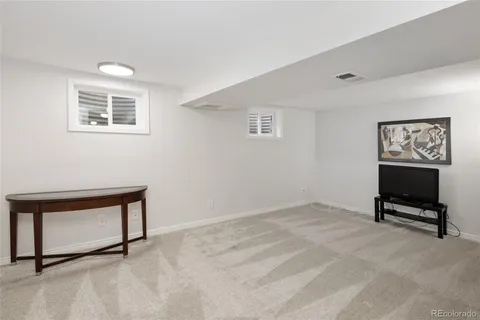a view of workspace with furniture and cabinet
