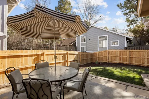 a view of backyard with a patio and outdoor seating