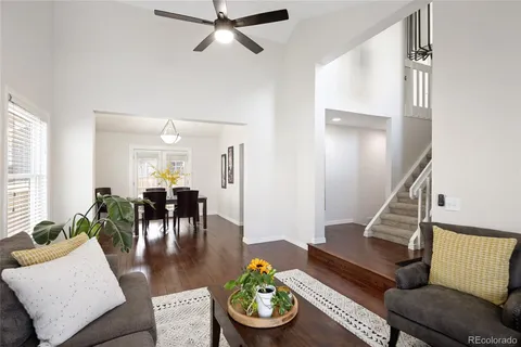 a living room with furniture and a dining area