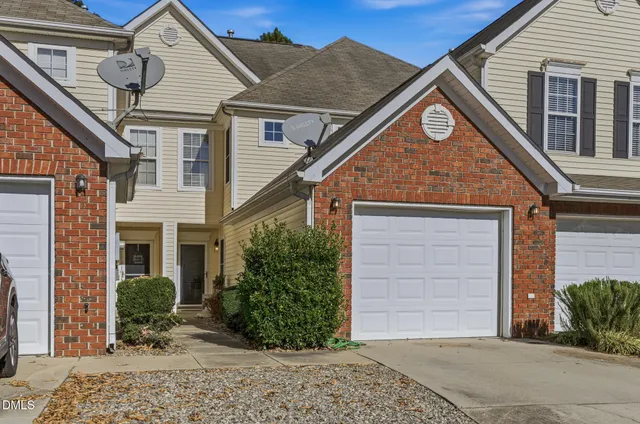 a view of a house with a yard and plants