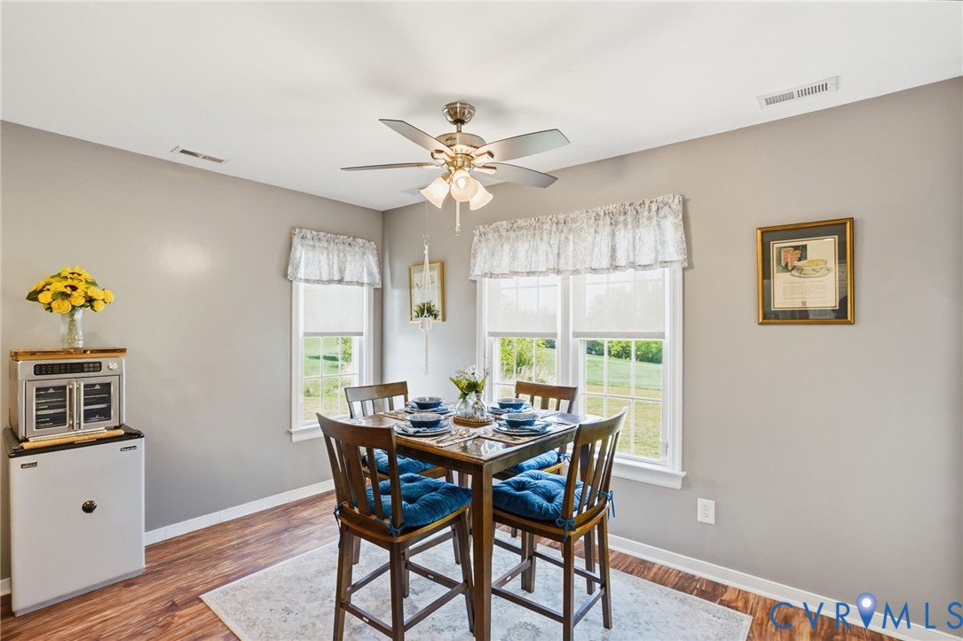 19012 Teman Road Beaverdam, VA 23015 - Photo 15 of 41 a view of a dining room with furniture window and wooden floor