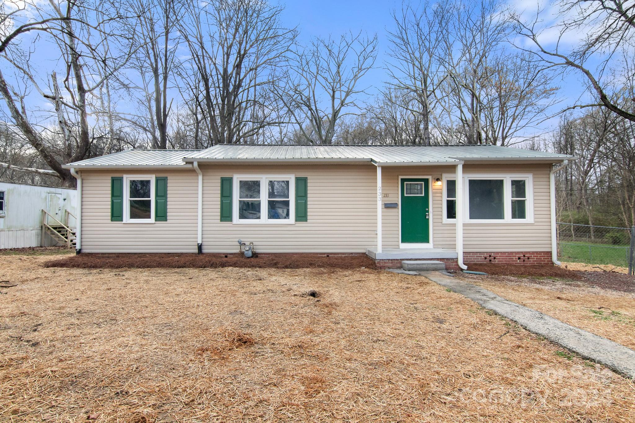 233 Charlotte Street York, SC 29745 - Photo 1 of 26 a house with trees in the background