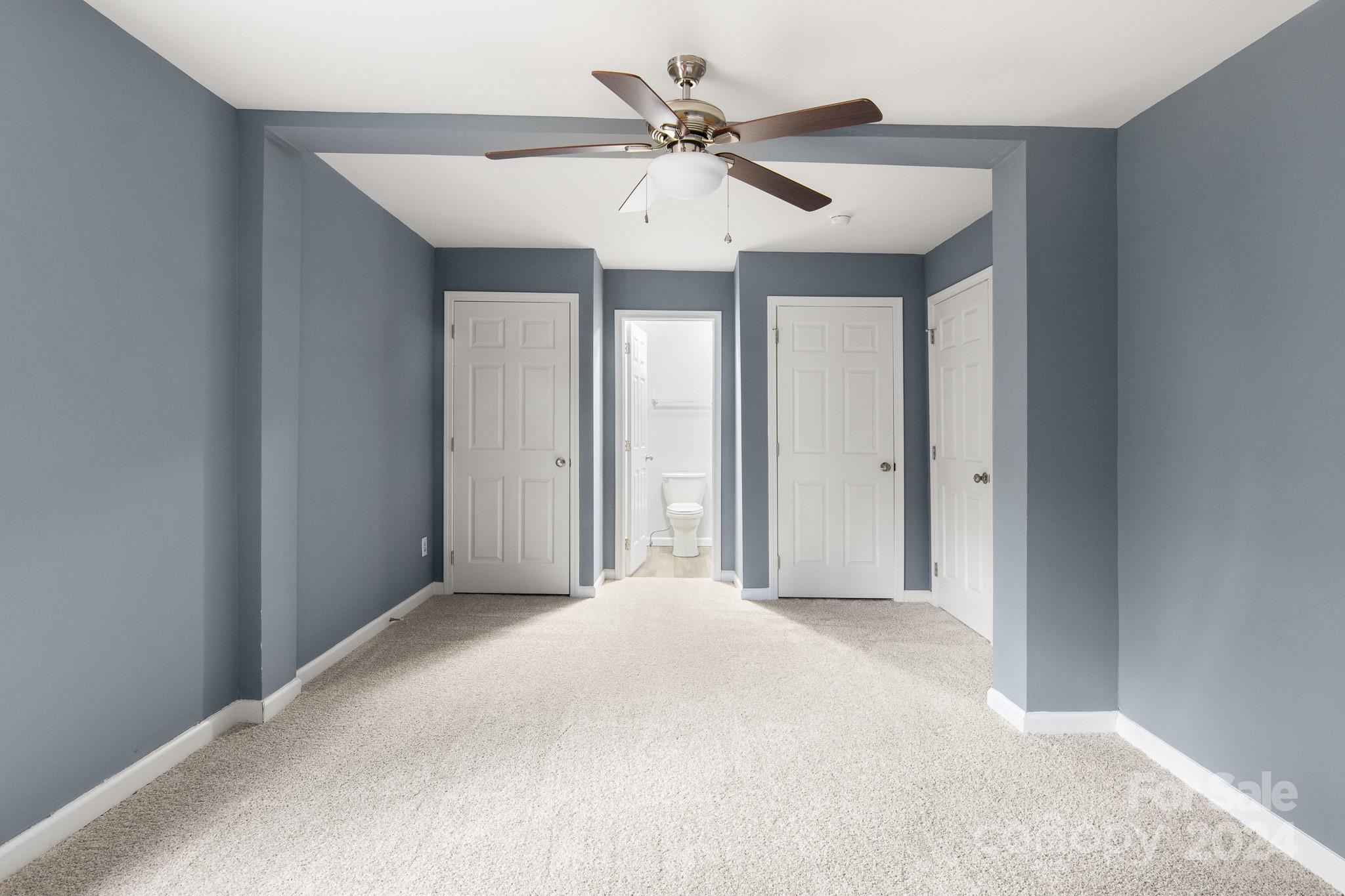 233 Charlotte Street York, SC 29745 - Photo 13 of 26 a view of a livingroom with a ceiling fan and window