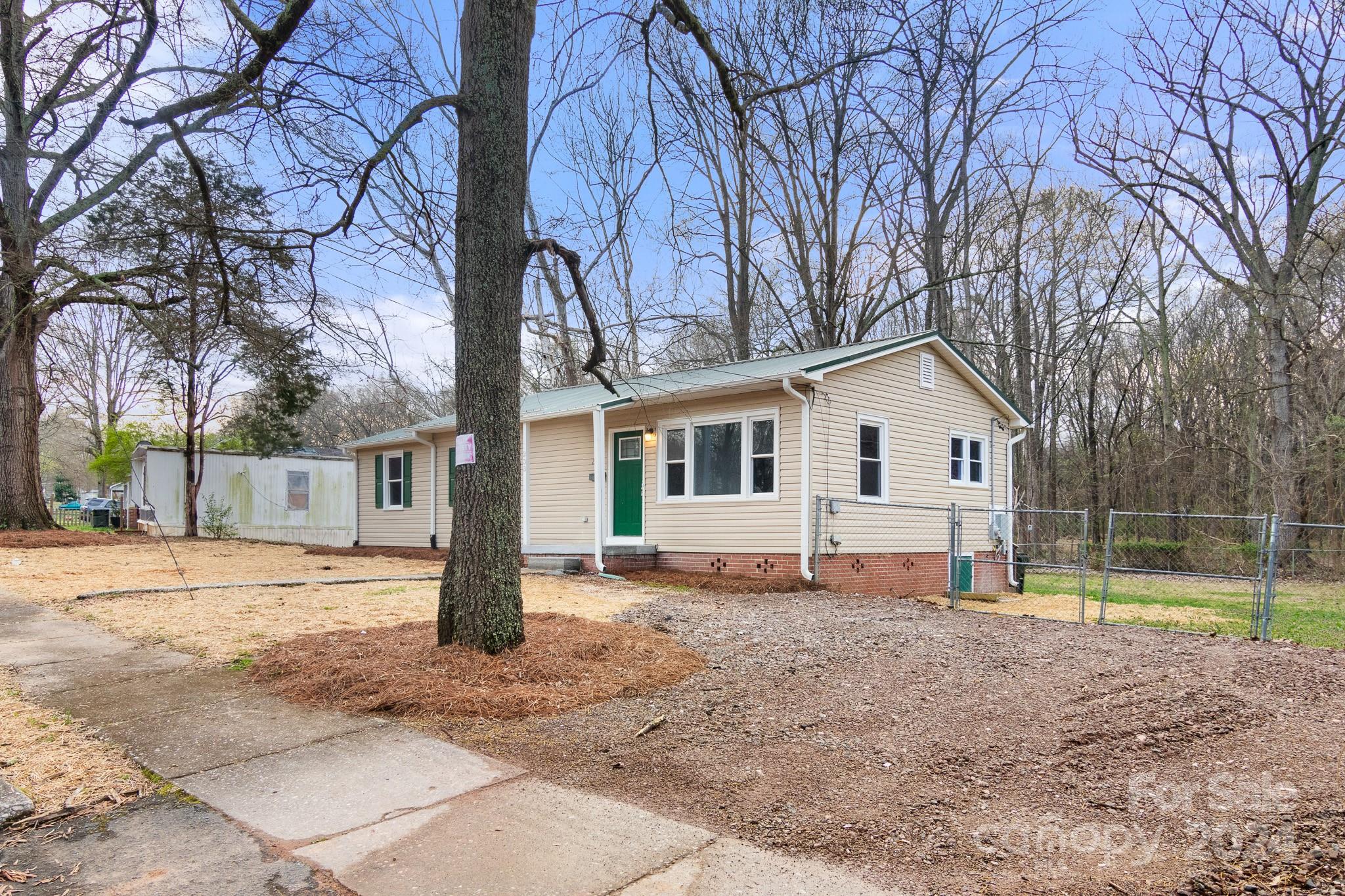 233 Charlotte Street York, SC 29745 - Photo 25 of 26 a view of a house with a yard covered in snow