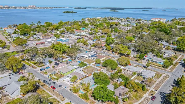 an aerial view of a city with lots of residential buildings ocean and ocean view