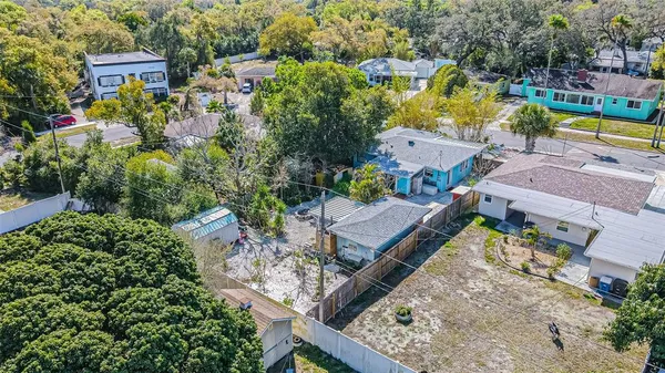 an aerial view of residential houses with outdoor space