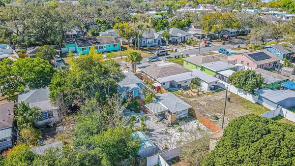 an aerial view of a house with a swimming pool yard and outdoor seating