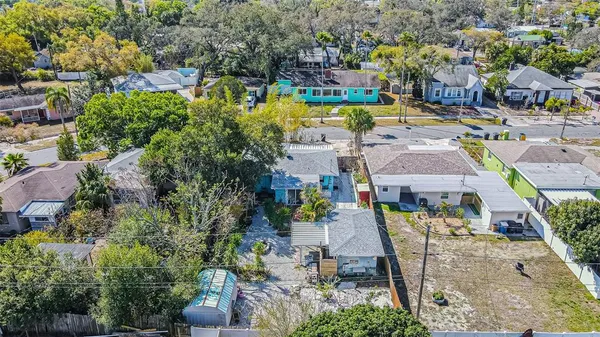 an aerial view of residential houses with outdoor space