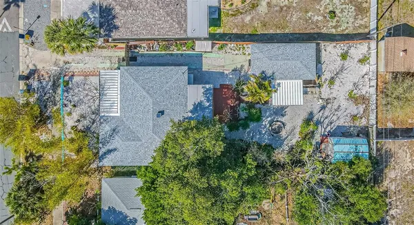 an aerial view of a house with a yard