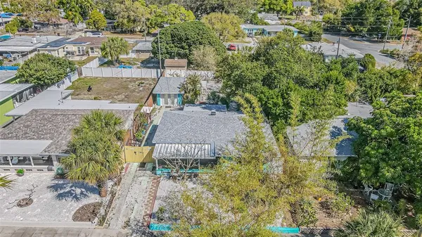an aerial view of residential houses with outdoor space