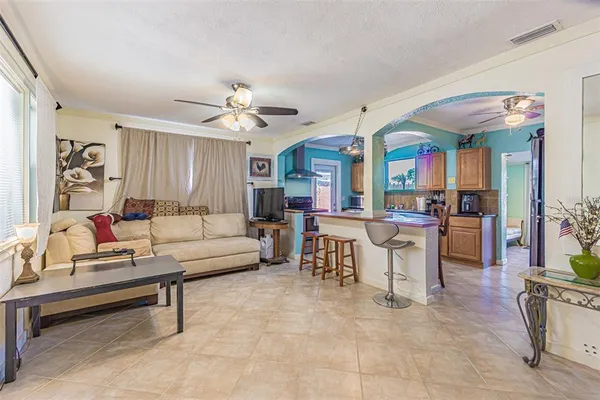a view of a livingroom with furniture and windows