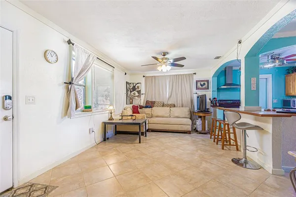 a kitchen with stainless steel appliances kitchen island granite countertop a stove and a sink